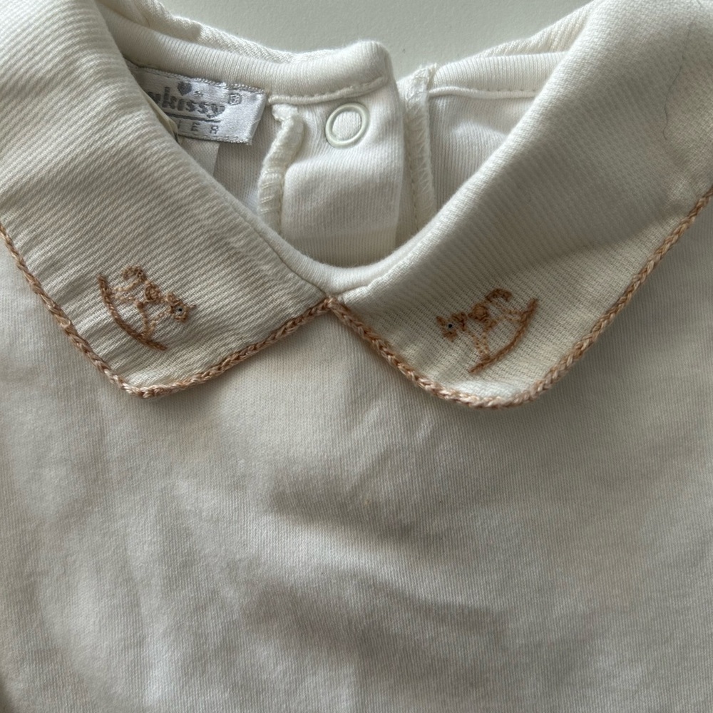 white collared long sleeve onesie w/ horse detailing on collar